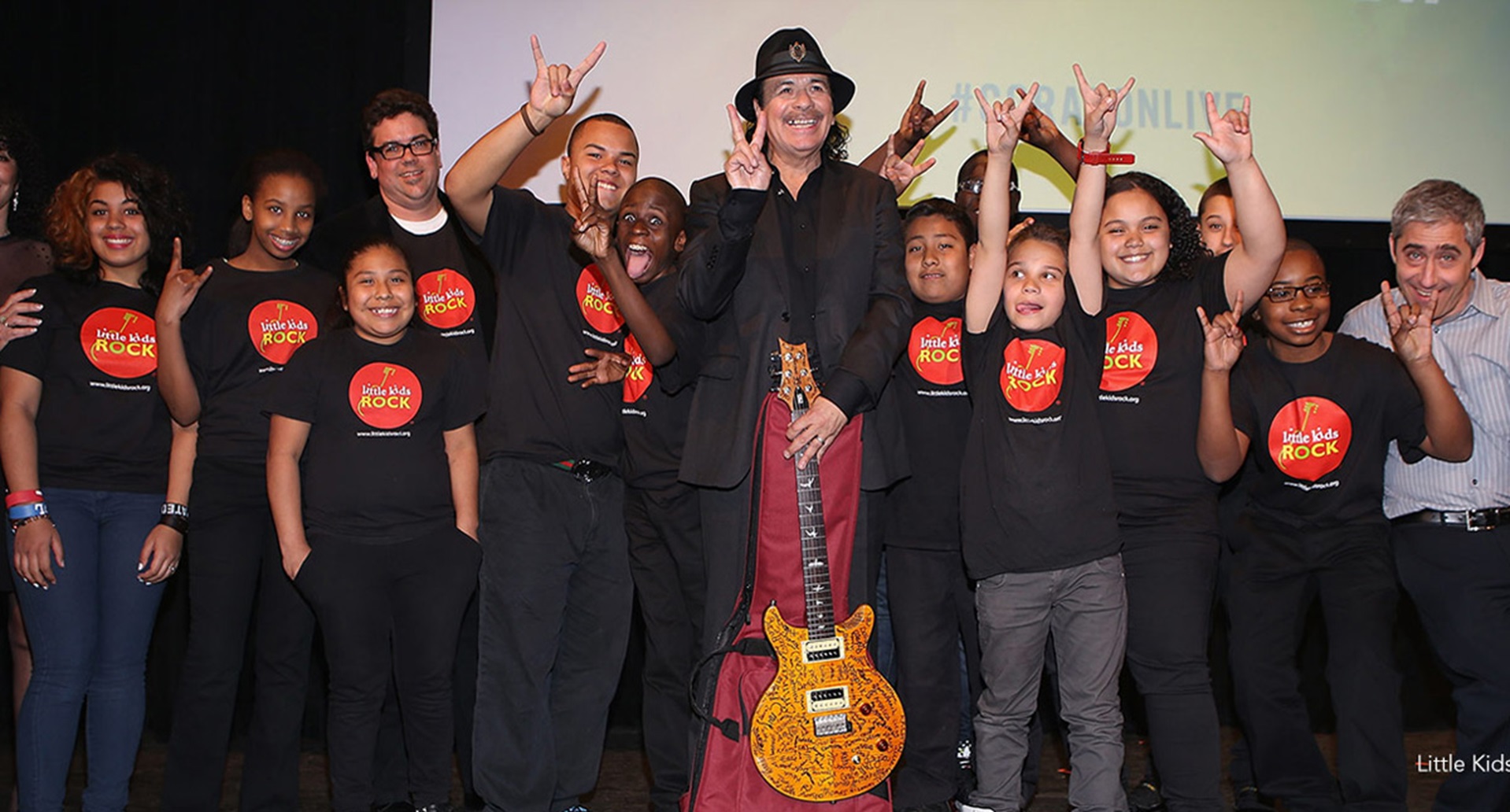 Milagro Foundation kids and Carlos Santana