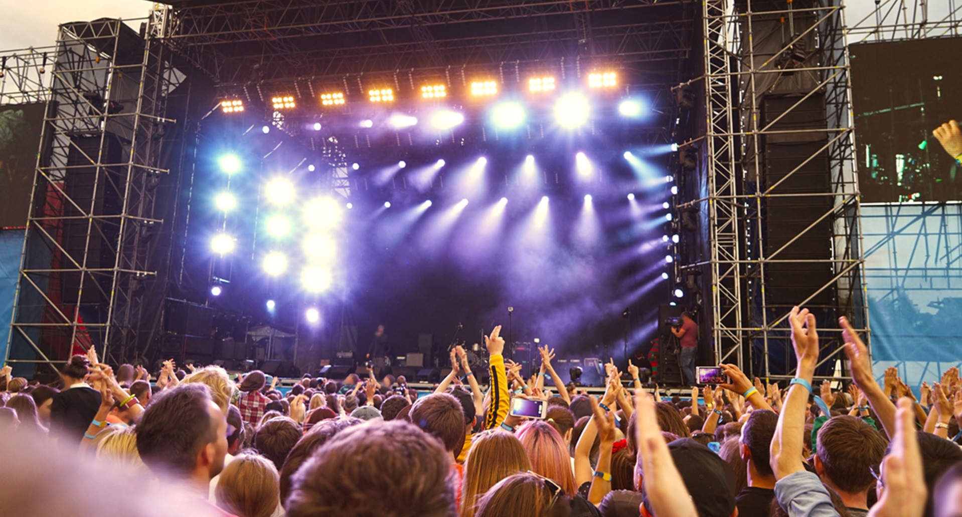 audience in front of stage for live music performance