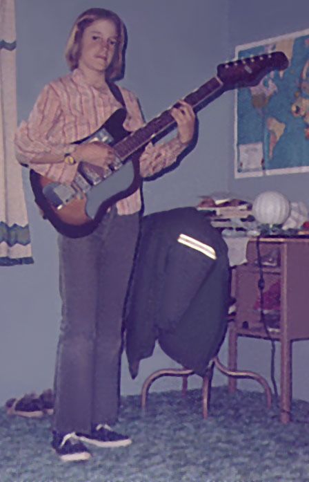 Michael at 12 with a guitar